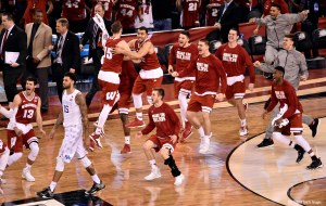 Badgers celebrate after beating the Kentucky Wildcats in the 2015 NCAA Men's Division I Championship semi-final game at Lucas Oil Stadium